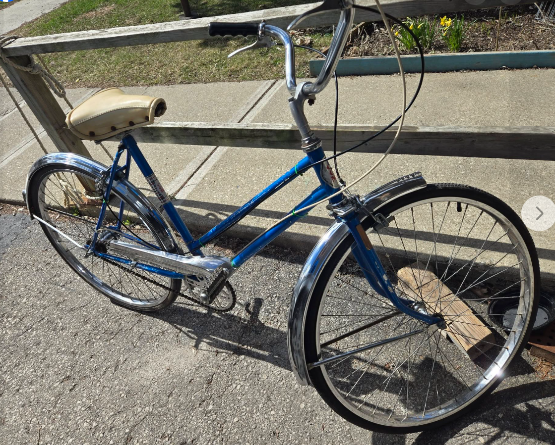 A blue everyday bicycle ready for inspection