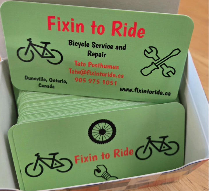 A box of Tate's original green Fixin to Ride bicycle repair cards